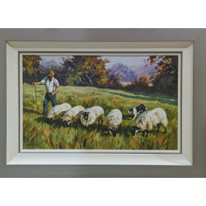 Idyllic sheep framer working with sheep and collie dog.